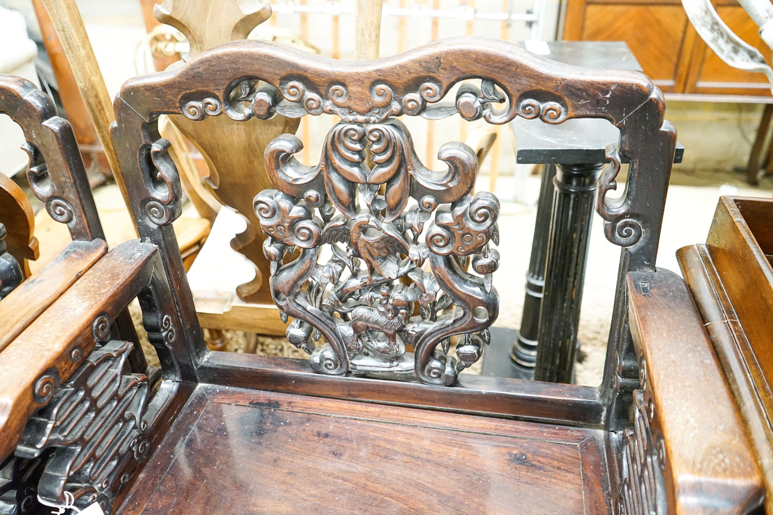 A pair of Chinese carved hongmu elbow chairs (a.f.), width 65cm, depth 48cm, height 96cm